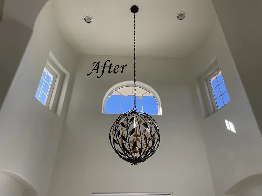 Modern chandelier in bright entryway