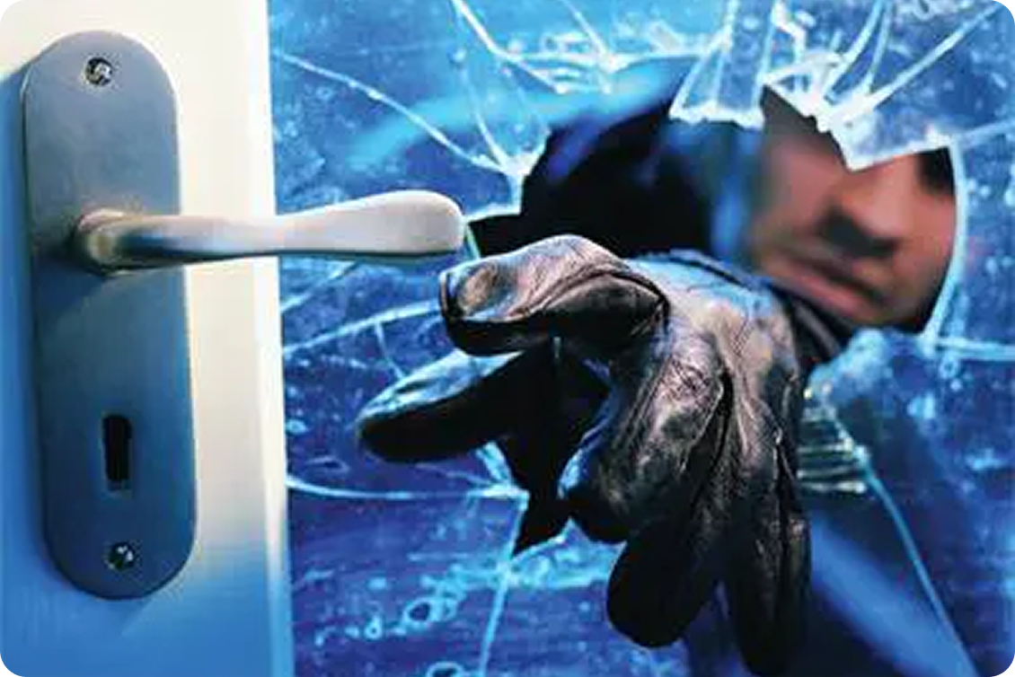 Burglar attempting to unlock door handle.